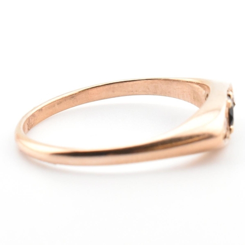 354 - A 10ct gold, sapphire and diamond boat ring. The 10ct rose gold ring having a central four claw roun... 