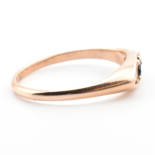 354 - A 10ct gold, sapphire and diamond boat ring. The 10ct rose gold ring having a central four claw roun... 