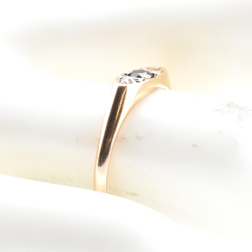 354 - A 10ct gold, sapphire and diamond boat ring. The 10ct rose gold ring having a central four claw roun... 