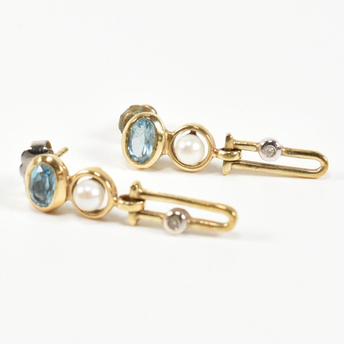 355 - A 14ct gold, topaz, diamond and cultured pearl pendant necklace and earring suite. The 14ct gold nec... 