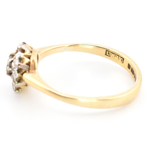 42 - A hallmarked 18ct gold and diamond cluster ring. The 18ct gold cluster ring having a central old cut... 