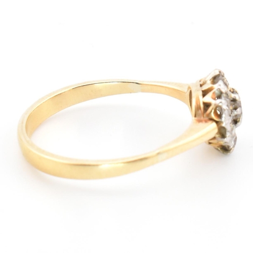 42 - A hallmarked 18ct gold and diamond cluster ring. The 18ct gold cluster ring having a central old cut... 