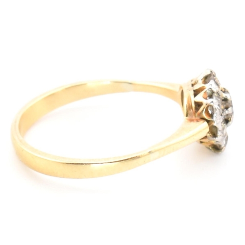 42 - A hallmarked 18ct gold and diamond cluster ring. The 18ct gold cluster ring having a central old cut... 