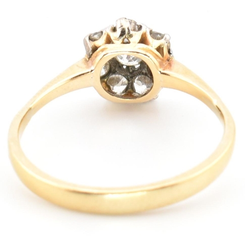 42 - A hallmarked 18ct gold and diamond cluster ring. The 18ct gold cluster ring having a central old cut... 