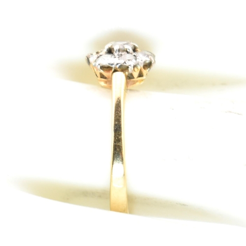 42 - A hallmarked 18ct gold and diamond cluster ring. The 18ct gold cluster ring having a central old cut... 