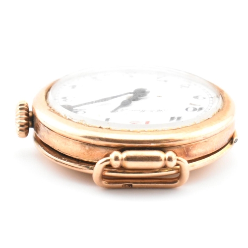 46A - A Henry Moser & Cie - Swiss 14k gold wristwatch. The watch with enamel Arabic dial signed Hy. Moser ... 