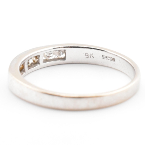 47 - A hallmarked 9ct white gold and diamond half eternity ring. The 9ct white gold ring having seven cha... 