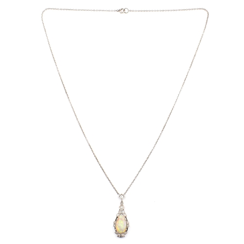 5 - A 1930s Art Deco white gold opal and diamond pendant necklace. The necklace strung with a pear cut o... 