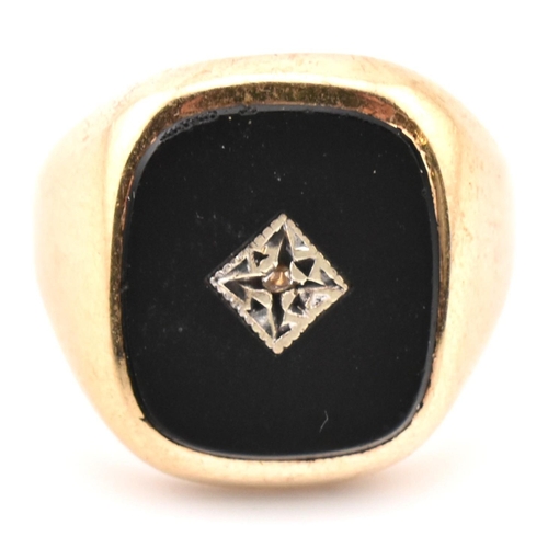 54 - A hallmarked 9ct gold onyx and diamond signet ring. The 9ct yellow gold signet ring having a rectang... 