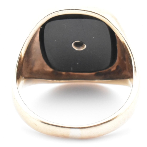 54 - A hallmarked 9ct gold onyx and diamond signet ring. The 9ct yellow gold signet ring having a rectang... 