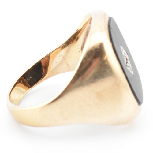 54 - A hallmarked 9ct gold onyx and diamond signet ring. The 9ct yellow gold signet ring having a rectang... 