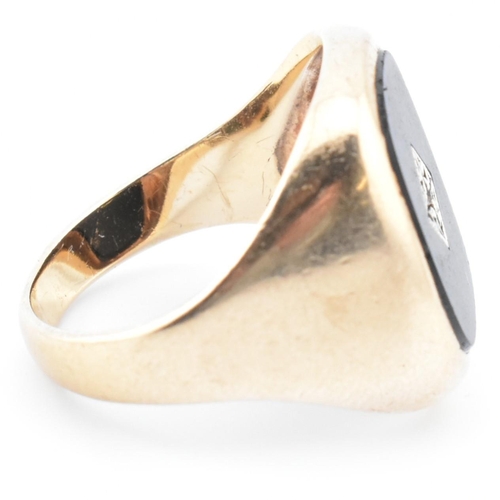 54 - A hallmarked 9ct gold onyx and diamond signet ring. The 9ct yellow gold signet ring having a rectang... 