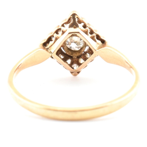 60 - A gold and diamond Art Deco lozenge ring. The Art Deco yellow gold ring having a central bezel set r... 