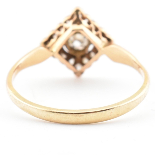 60 - A gold and diamond Art Deco lozenge ring. The Art Deco yellow gold ring having a central bezel set r... 