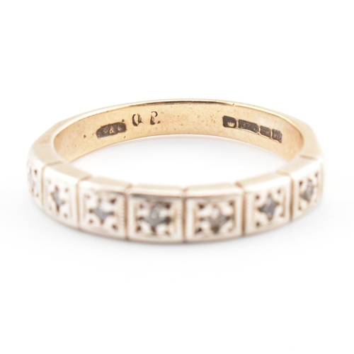 61 - A hallmarked 9ct gold and diamond half eternity ring. The 9ct yellow gold half eternity ring having ... 