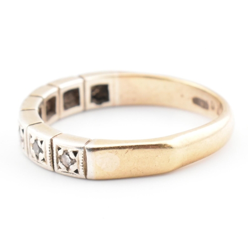 61 - A hallmarked 9ct gold and diamond half eternity ring. The 9ct yellow gold half eternity ring having ... 