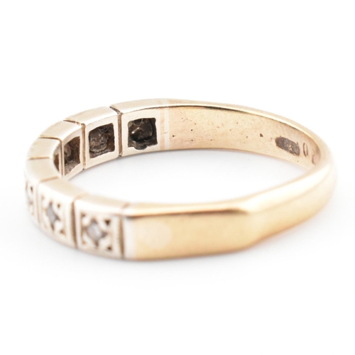 61 - A hallmarked 9ct gold and diamond half eternity ring. The 9ct yellow gold half eternity ring having ... 