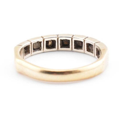 61 - A hallmarked 9ct gold and diamond half eternity ring. The 9ct yellow gold half eternity ring having ... 