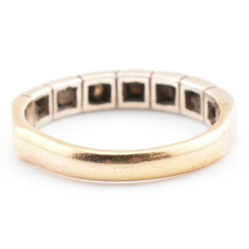 61 - A hallmarked 9ct gold and diamond half eternity ring. The 9ct yellow gold half eternity ring having ... 