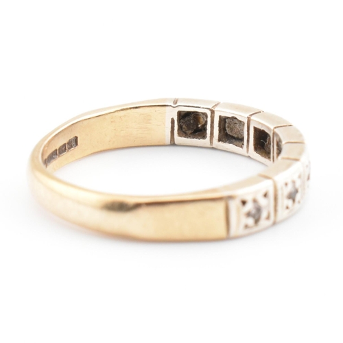 61 - A hallmarked 9ct gold and diamond half eternity ring. The 9ct yellow gold half eternity ring having ... 