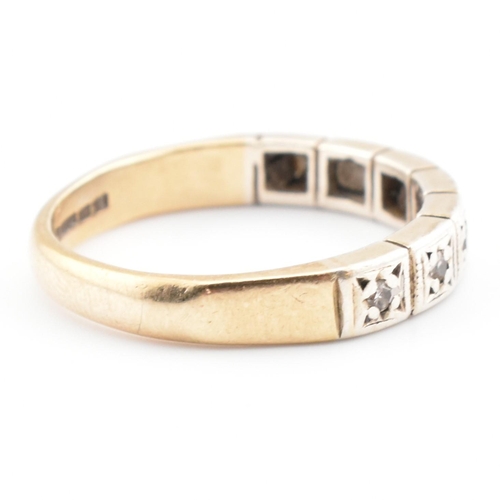 61 - A hallmarked 9ct gold and diamond half eternity ring. The 9ct yellow gold half eternity ring having ... 