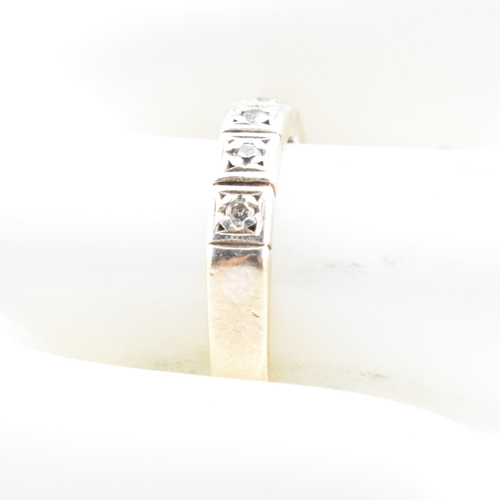 61 - A hallmarked 9ct gold and diamond half eternity ring. The 9ct yellow gold half eternity ring having ... 