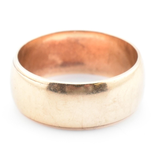 64 - A hallmarked 9ct gold band ring. The 9ct yellow gold band ring hallmarked for London, 1962. Maker's ... 