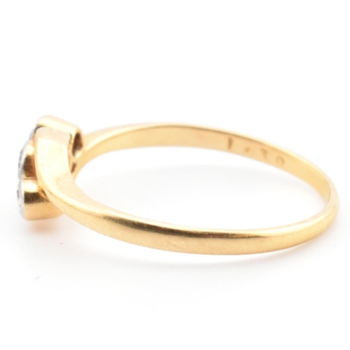 68 - A cased 18ct gold and diamond three stone crossover ring. The 18ct yellow gold ring having three gra... 