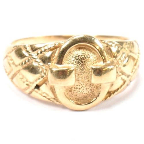 69 - A hallmarked 9ct gold buckle ring. The hallmarked gold ring having a central round buckle design to ... 