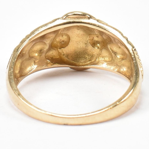 69 - A hallmarked 9ct gold buckle ring. The hallmarked gold ring having a central round buckle design to ... 