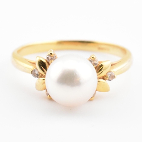 72 - An 18ct gold, cultured pearl and diamond dress ring. The 18ct yellow gold ring having a single semi-... 