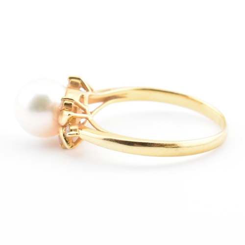 72 - An 18ct gold, cultured pearl and diamond dress ring. The 18ct yellow gold ring having a single semi-... 