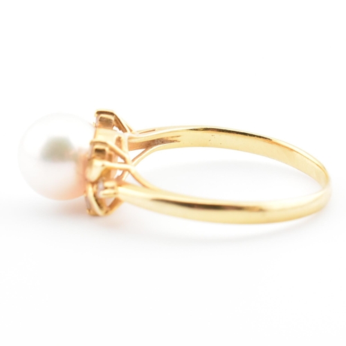 72 - An 18ct gold, cultured pearl and diamond dress ring. The 18ct yellow gold ring having a single semi-... 