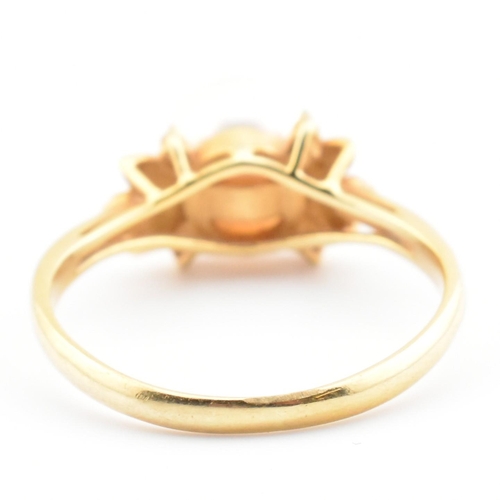 72 - An 18ct gold, cultured pearl and diamond dress ring. The 18ct yellow gold ring having a single semi-... 