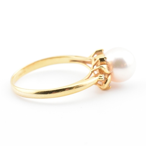 72 - An 18ct gold, cultured pearl and diamond dress ring. The 18ct yellow gold ring having a single semi-... 