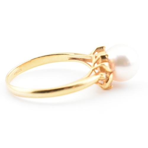 72 - An 18ct gold, cultured pearl and diamond dress ring. The 18ct yellow gold ring having a single semi-... 