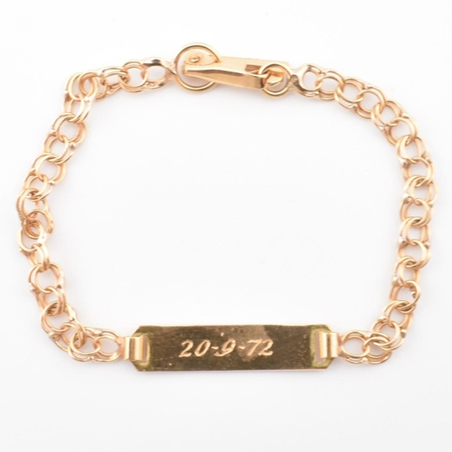 75 - A gold christening bracelet with name plate. The gold double curb link christening bracelet having a... 