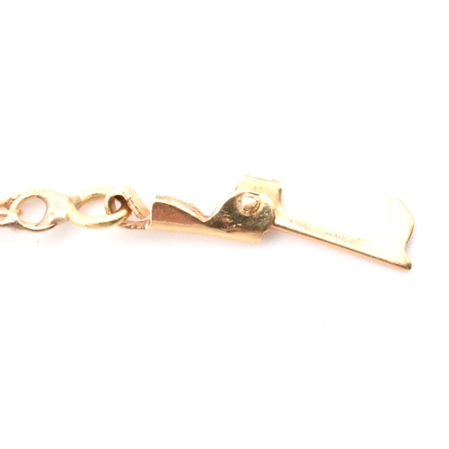 75 - A gold christening bracelet with name plate. The gold double curb link christening bracelet having a... 