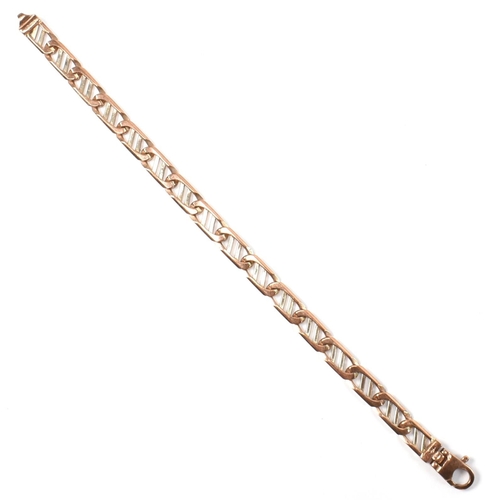 79 - A hallmarked 9ct gold two-tone fancy link chain bracelet. The bracelet having 9ct rose and white gol... 