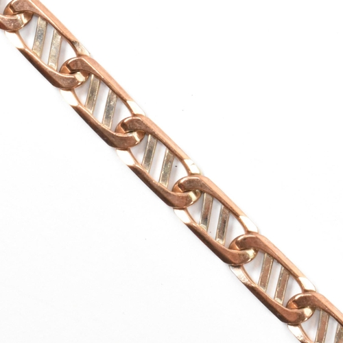 79 - A hallmarked 9ct gold two-tone fancy link chain bracelet. The bracelet having 9ct rose and white gol... 