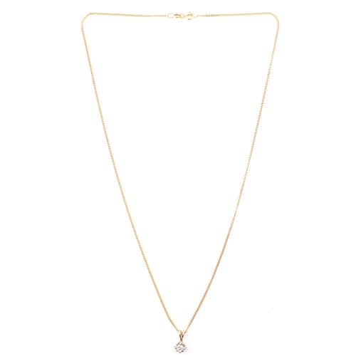 81 - A hallmarked Italian 9ct gold and diamond pendant necklace. The 9ct yellow gold curb link chain neck... 