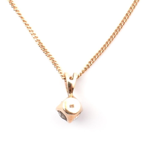 81 - A hallmarked Italian 9ct gold and diamond pendant necklace. The 9ct yellow gold curb link chain neck... 