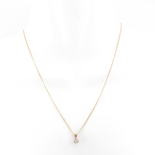 81 - A hallmarked Italian 9ct gold and diamond pendant necklace. The 9ct yellow gold curb link chain neck... 