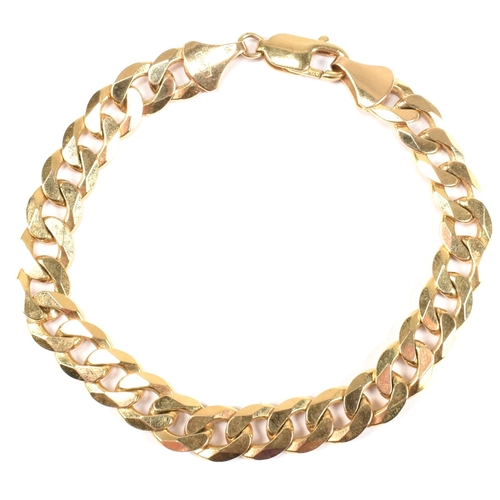 82 - An Italian hallmarked 9ct gold curb link chain bracelet. The 9ct yellow gold bracelet hallmarked for... 