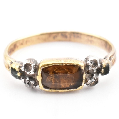 85 - A 19th century gold and silver gem set ring. The ring set with a bezel set citrine flanked by diamon... 