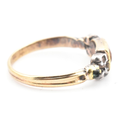 85 - A 19th century gold and silver gem set ring. The ring set with a bezel set citrine flanked by diamon... 