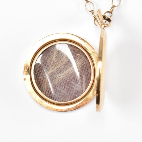 86 - A Georg Jensen hallmarked 9ct gold locket pendant necklace. The hallmarked 9ct gold cable chain neck... 