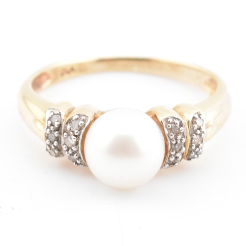 87 - A hallmarked 9ct gold, diamond and cultured pearl ring. The 9ct yellow gold ring having a single rou... 