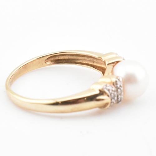 87 - A hallmarked 9ct gold, diamond and cultured pearl ring. The 9ct yellow gold ring having a single rou... 