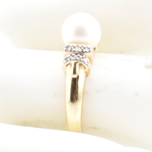 87 - A hallmarked 9ct gold, diamond and cultured pearl ring. The 9ct yellow gold ring having a single rou... 